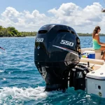 150 hp outboard motor for sale on a boat with family enjoying fun water activities.